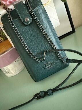 Coach, leather phone holder Crossbody w/side pocket that will hold cards/cash